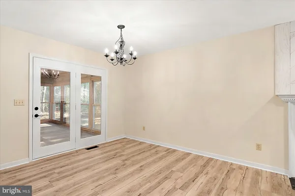 a kitchen with granite countertop cabinets stainless steel appliances and a sink