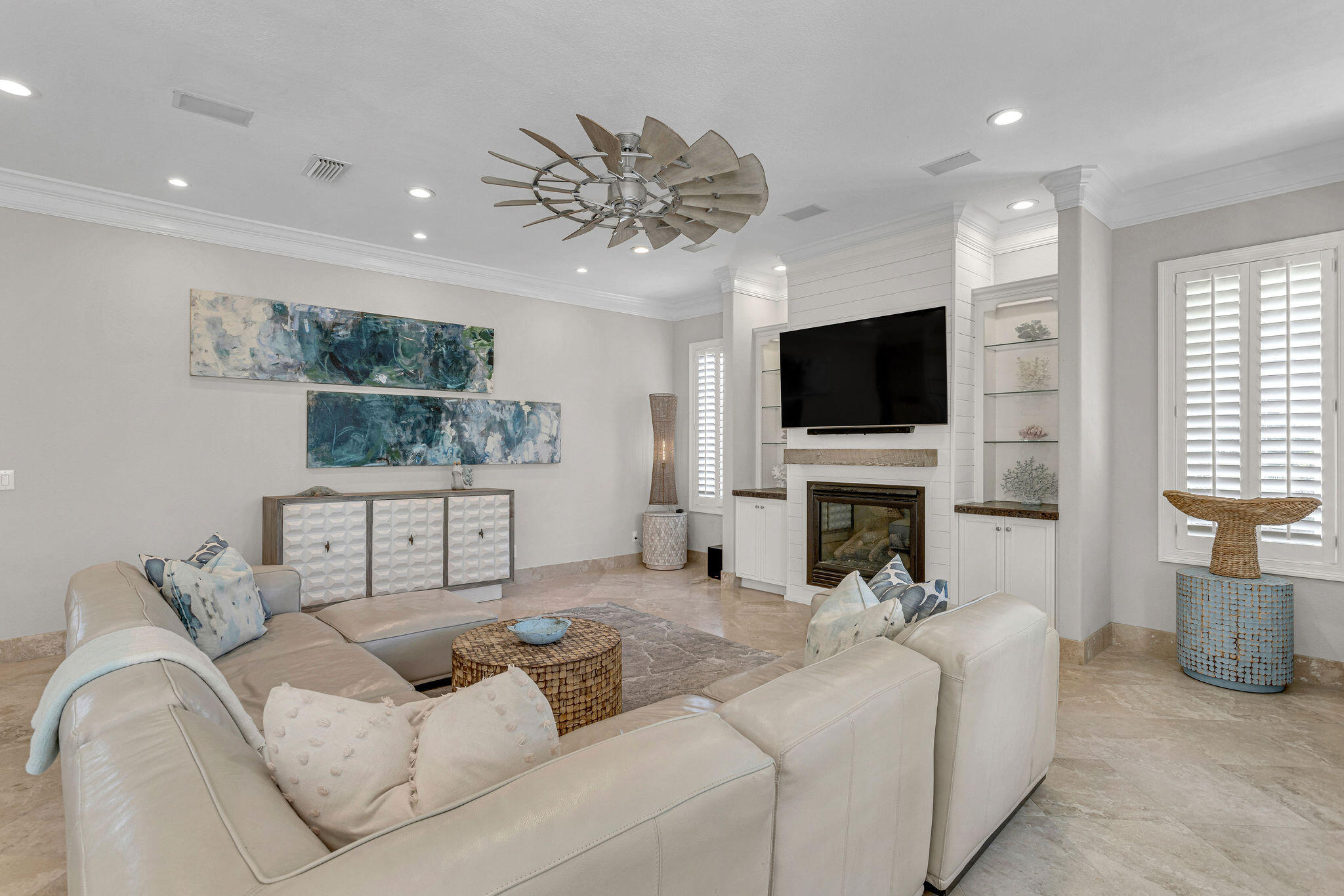 4713 Ocean Boulevard Destin, FL 32541 - Photo 11 of 90 a living room with furniture a fireplace and a flat screen tv