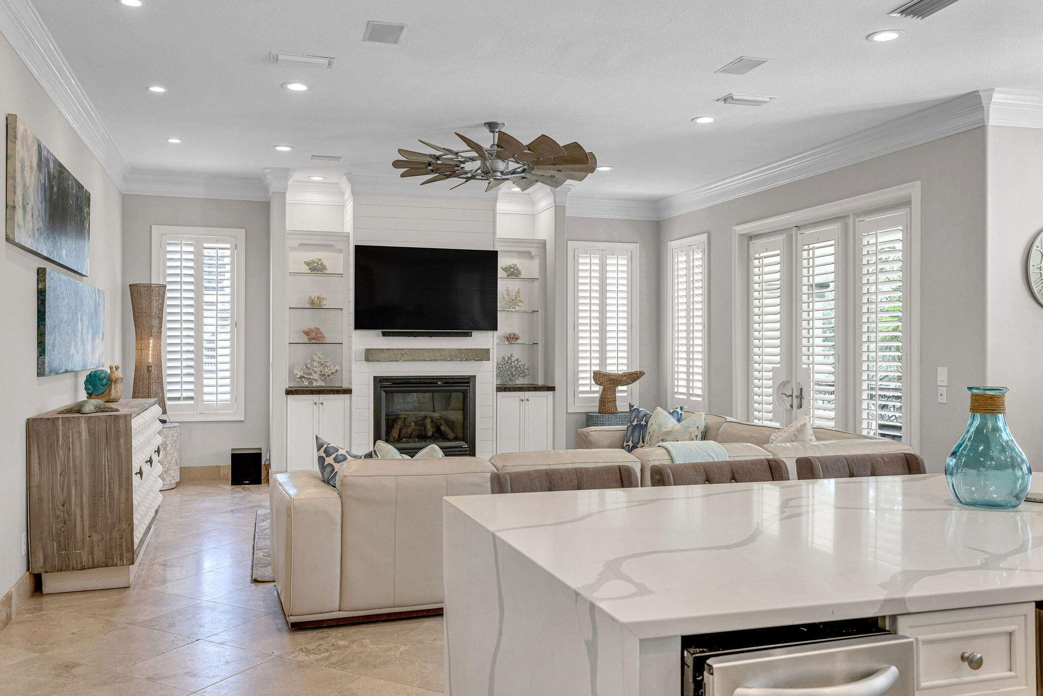 4713 Ocean Boulevard Destin, FL 32541 - Photo 12 of 90 a living room with fireplace furniture and a flat screen tv