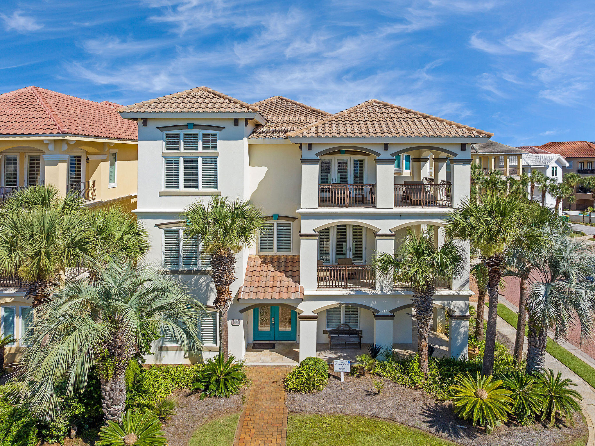4713 Ocean Boulevard Destin, FL 32541 - Photo 19 of 90 a front view of a house with a yard