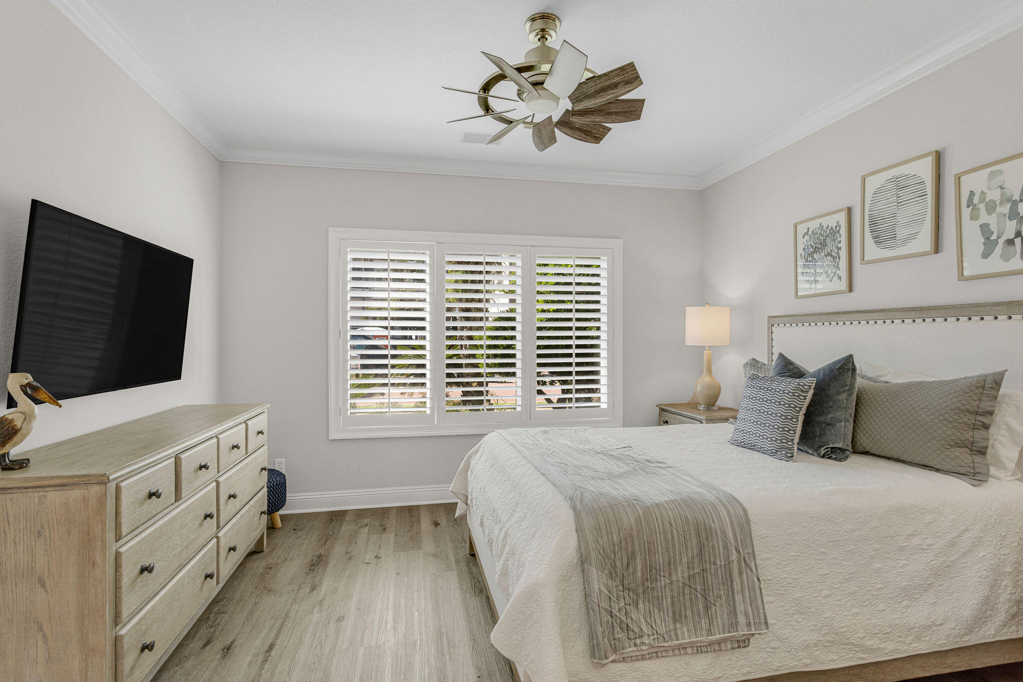 4713 Ocean Boulevard Destin, FL 32541 - Photo 25 of 90 a bedroom with a bed and a flat screen tv
