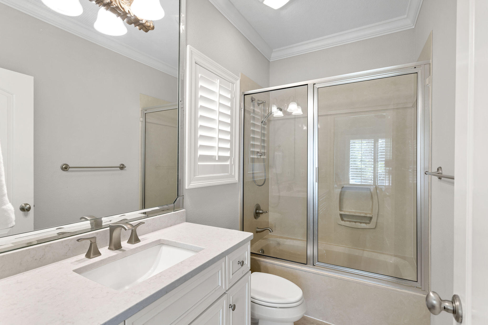 4713 Ocean Boulevard Destin, FL 32541 - Photo 28 of 90 a bathroom with a sink a toilet and shower