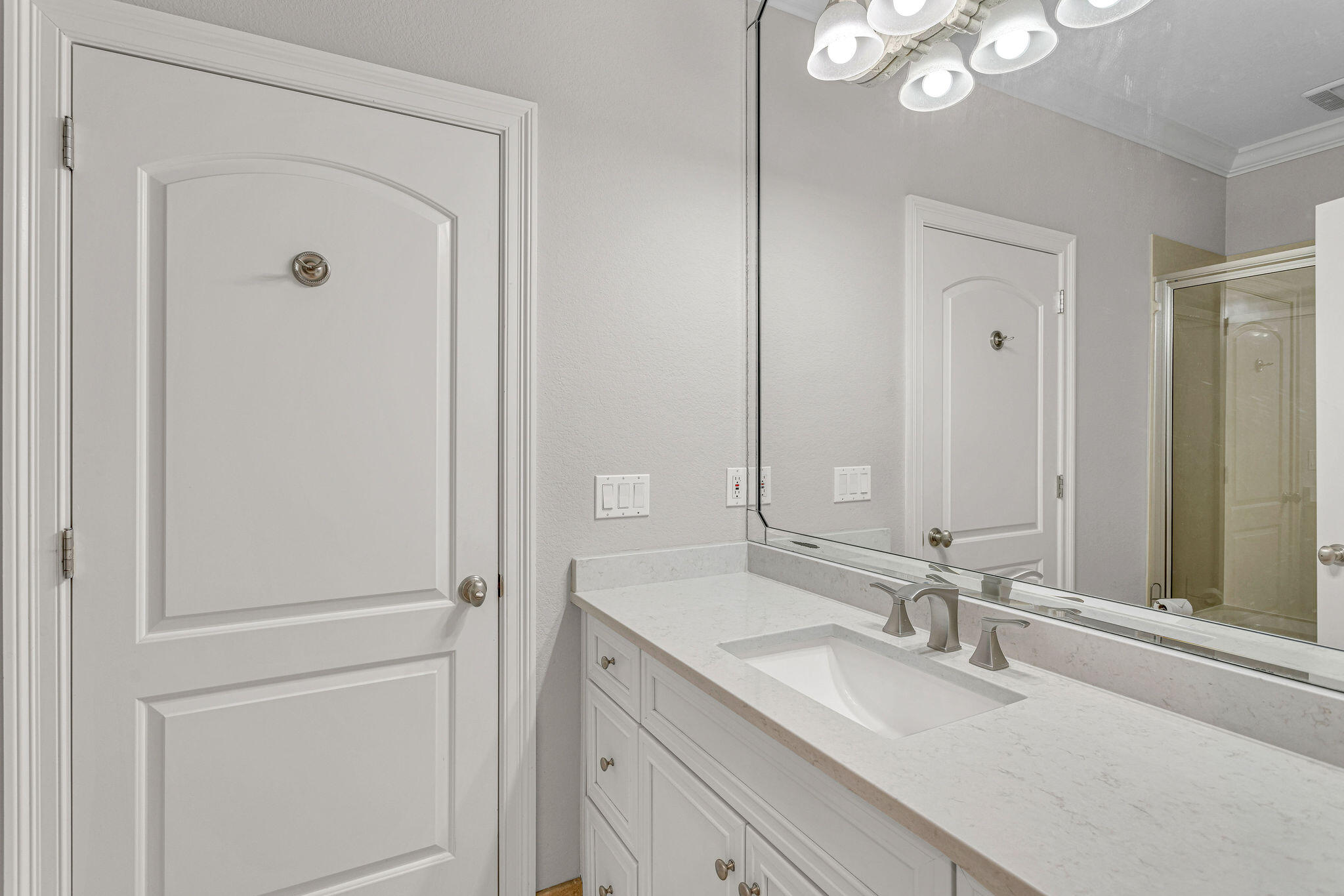 4713 Ocean Boulevard Destin, FL 32541 - Photo 30 of 90 a bathroom with a double vanity sink and a mirror