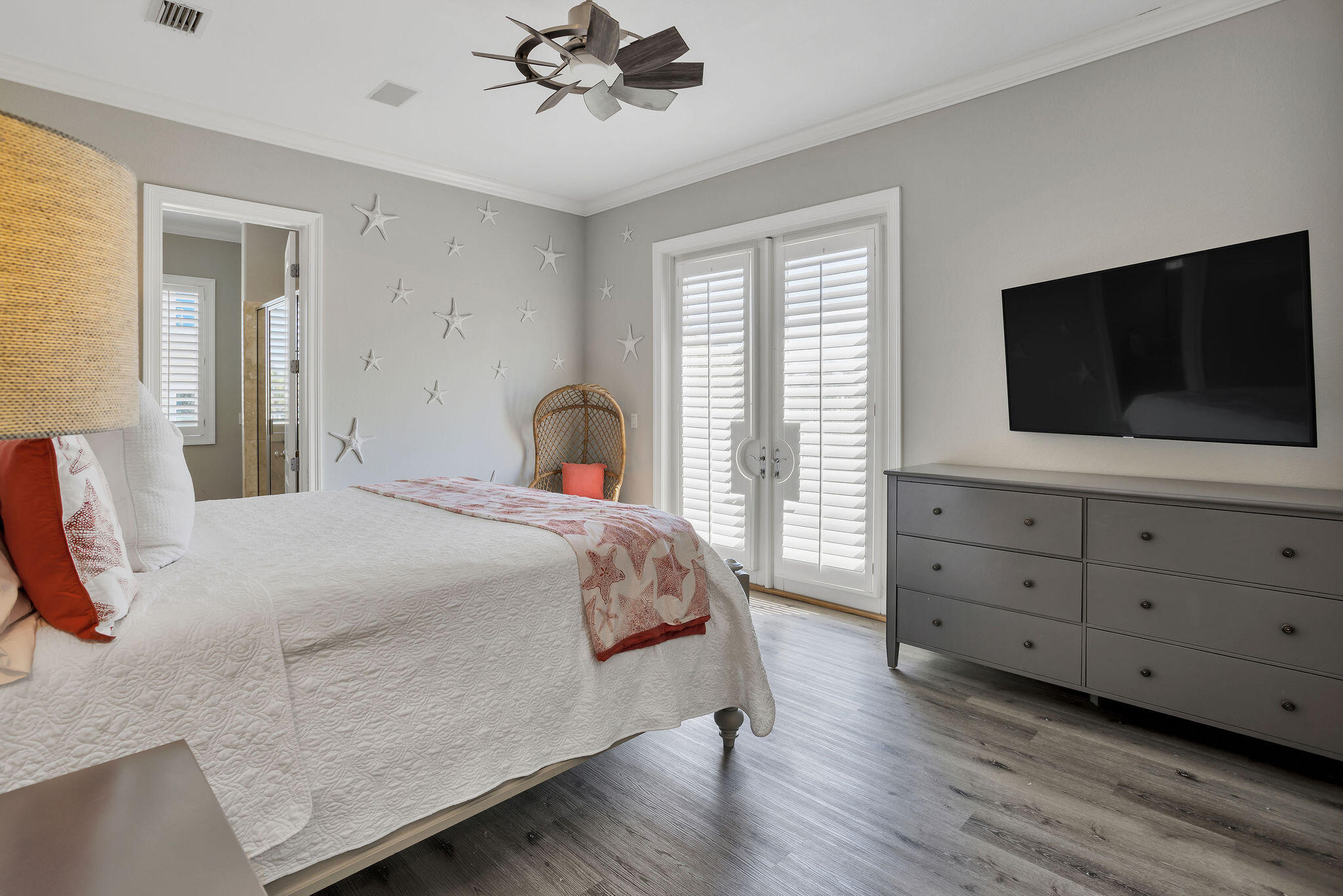 4713 Ocean Boulevard Destin, FL 32541 - Photo 54 of 90 a bedroom with a bed and a flat screen tv
