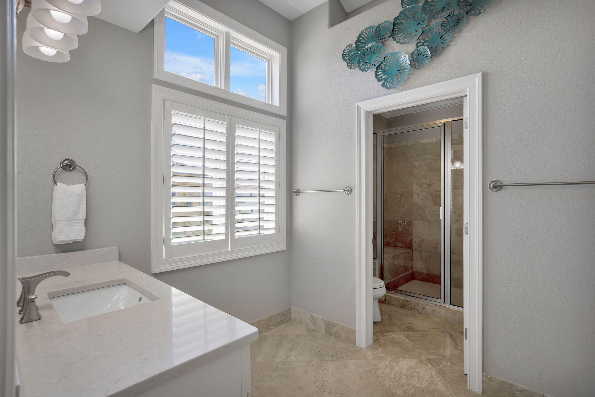 4713 Ocean Boulevard Destin, FL 32541 - Photo 63 of 90 a bathroom with a sink a toilet and shower