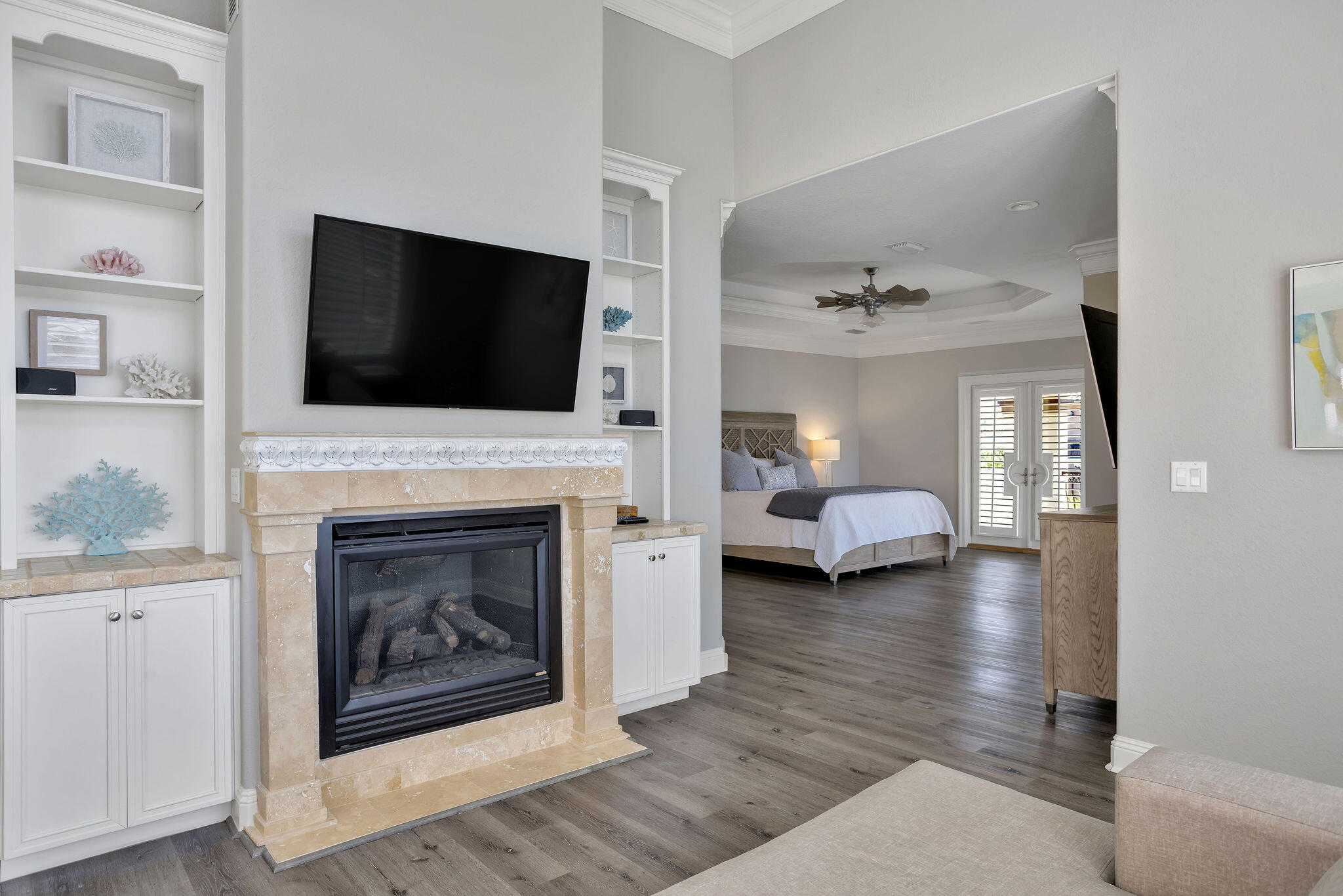 4713 Ocean Boulevard Destin, FL 32541 - Photo 67 of 90 a living room with furniture a fireplace and a flat screen tv