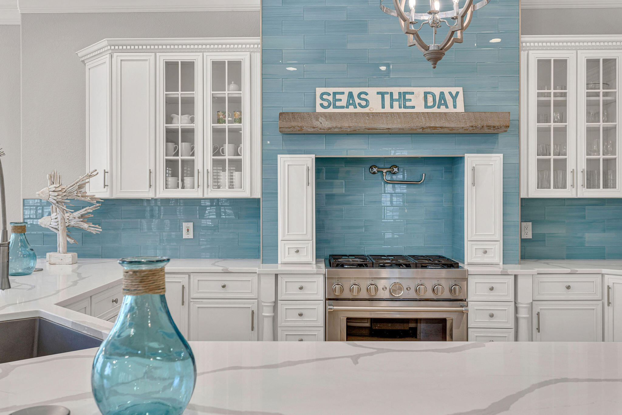 4713 Ocean Boulevard Destin, FL 32541 - Photo 8 of 90 a kitchen with granite countertop a stove and a sink