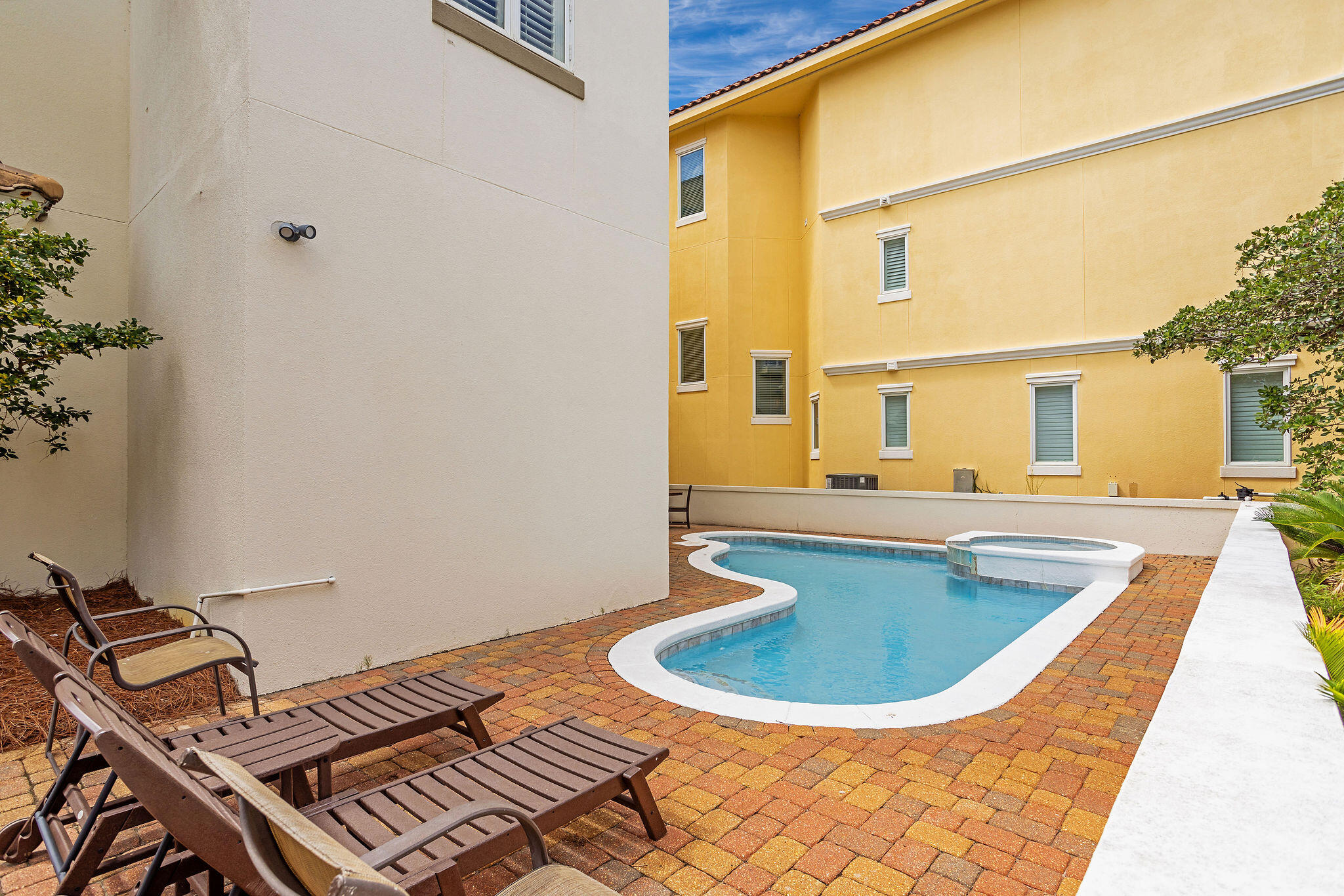 4713 Ocean Boulevard Destin, FL 32541 - Photo 86 of 90 a view of a swimming pool with a lounge chair