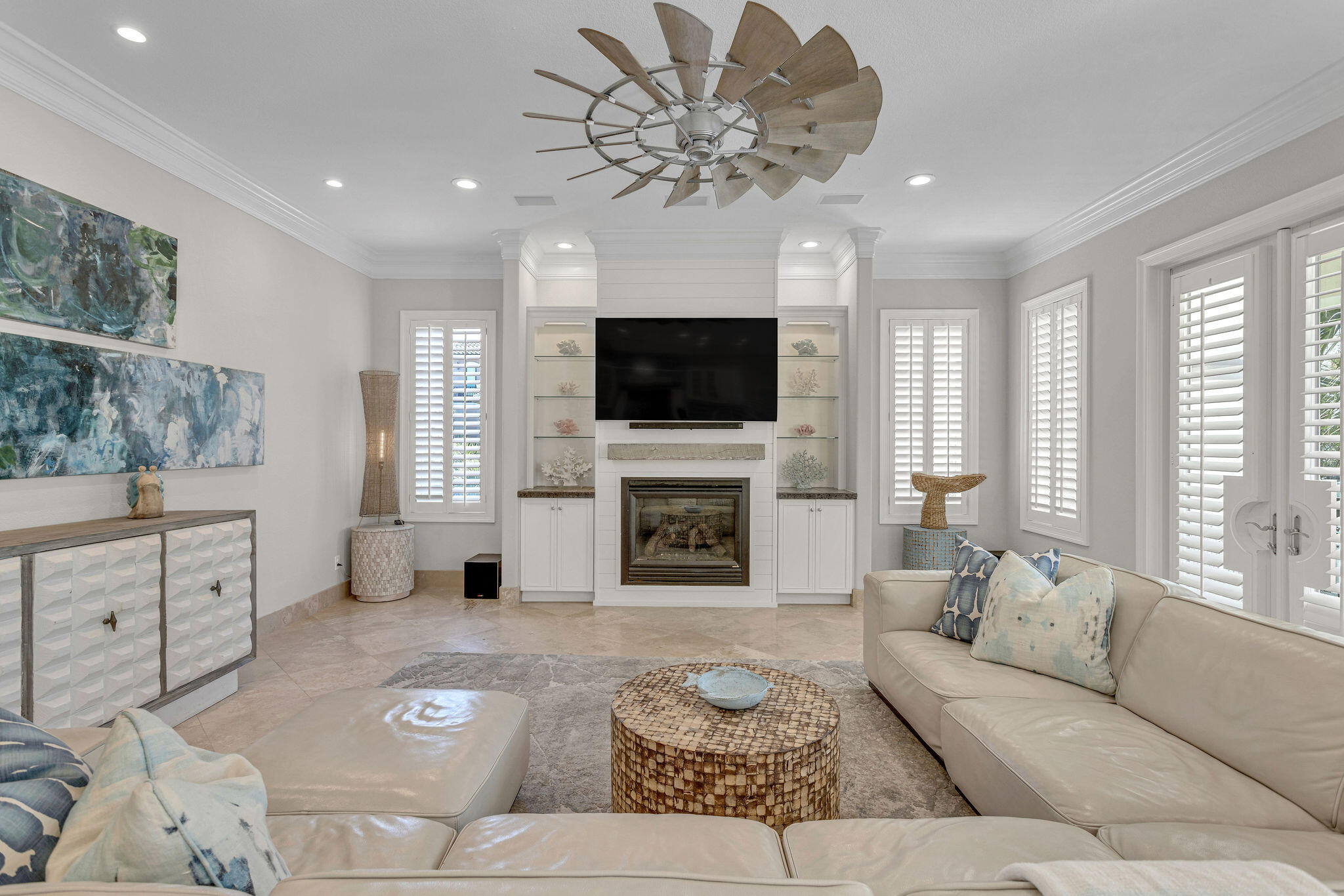 4713 Ocean Boulevard Destin, FL 32541 - Photo 10 of 90 a living room with furniture a fireplace and a flat screen tv