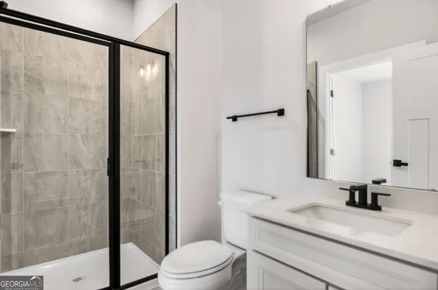 a spacious bedroom with a bed and a window