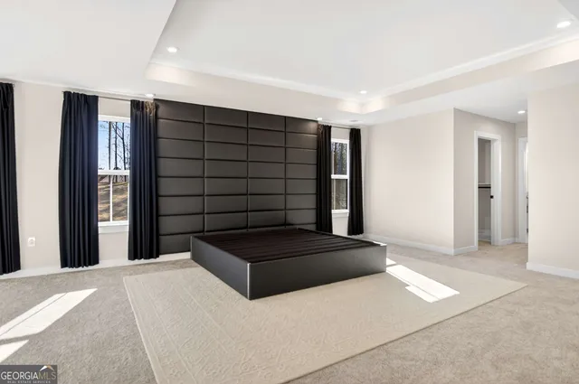 a spacious bathroom with a double vanity sink mirror and shower