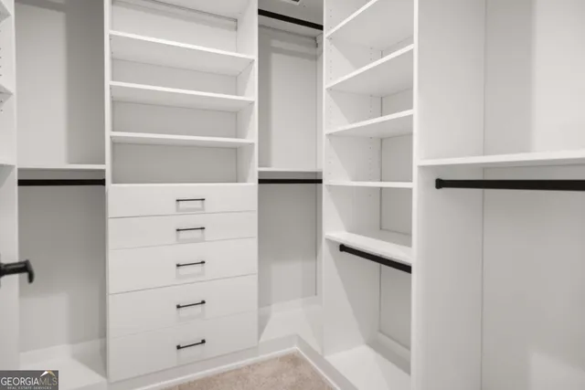 a bathroom with a sink a toilet a tub and a mirror