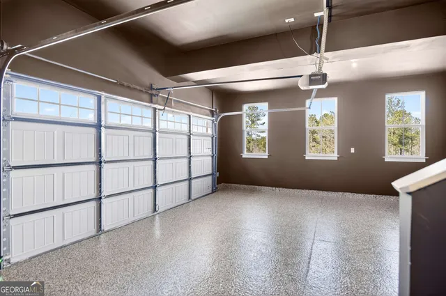 a view of a brick house with a small yard