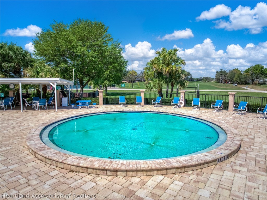 4734 Haw Branch Road, Unit 110 Sebring, FL 33875 - Photo 43 of 50 a view of house with swimming pool and yard