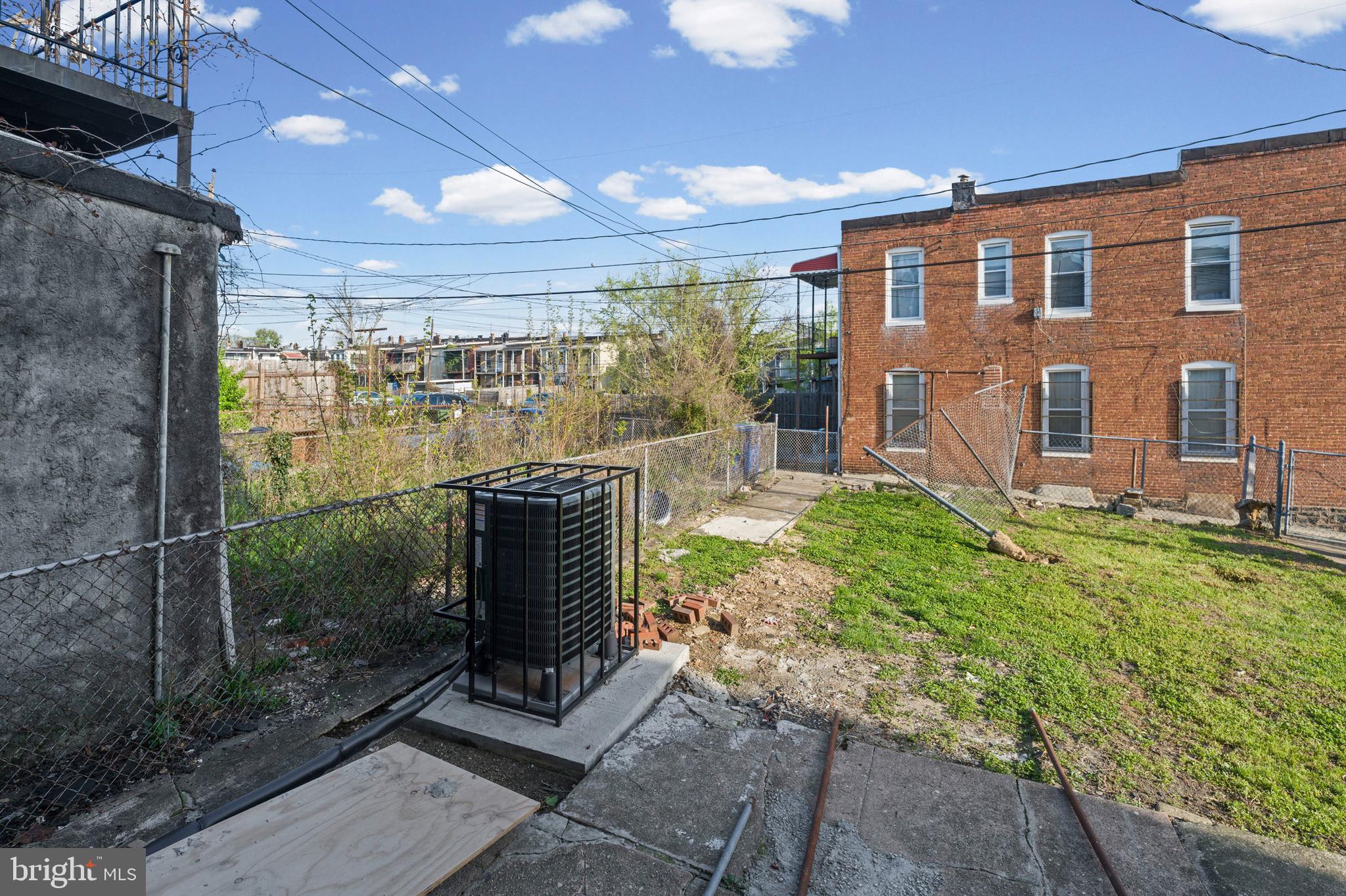 2806 Riggs Avenue Baltimore, MD 21216 - Photo 12 of 32 a view of a porch with chairs and backyard