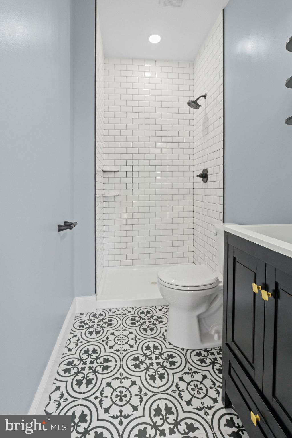 2806 Riggs Avenue Baltimore, MD 21216 - Photo 23 of 32 a bathroom with a toilet and a shower