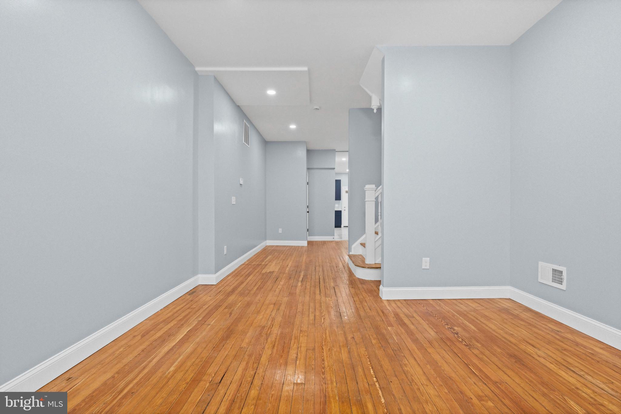 2806 Riggs Avenue Baltimore, MD 21216 - Photo 30 of 32 a view of empty room with wooden floor