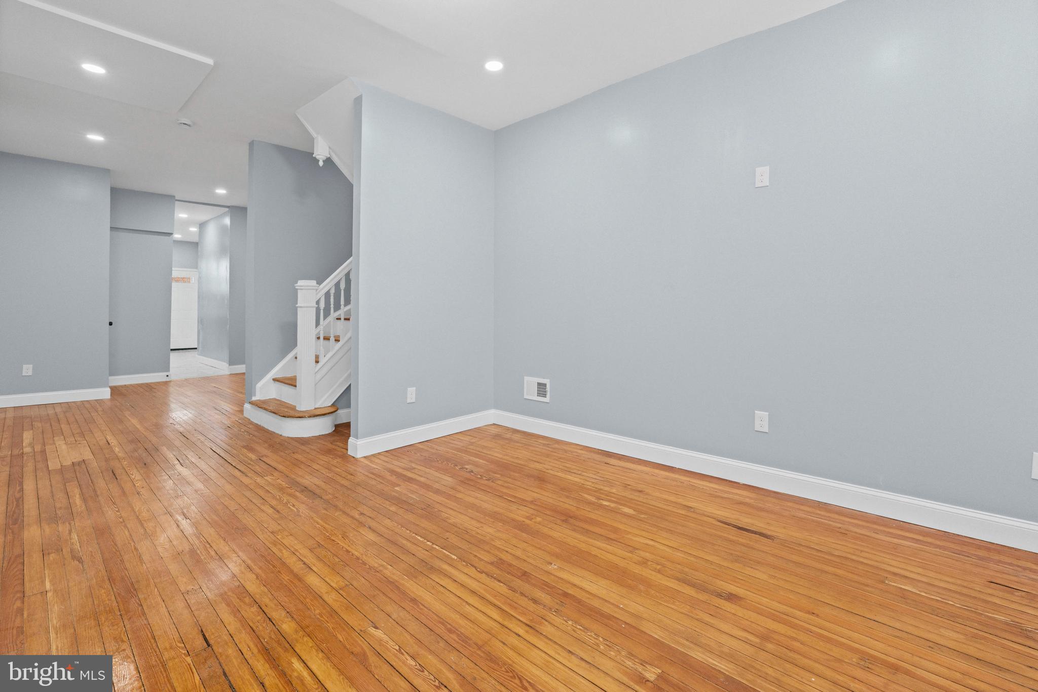 2806 Riggs Avenue Baltimore, MD 21216 - Photo 31 of 32 a view of empty room with wooden floor