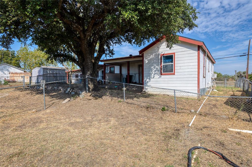 6473 West Highway 199 Springtown, TX 76082 - Photo 11 of 40 Back of house with a fenced backyard