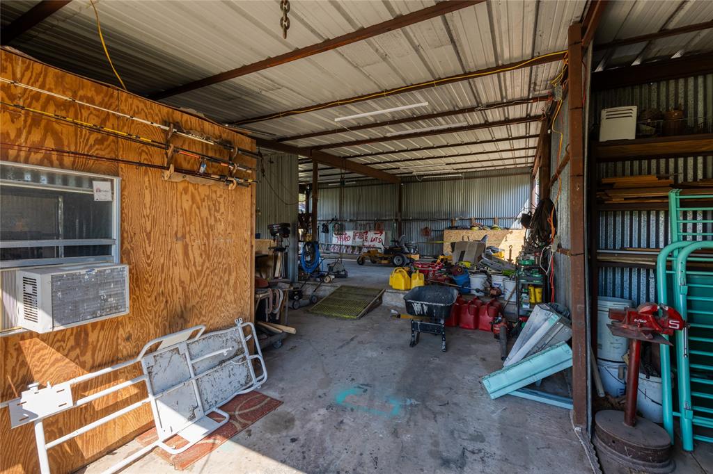 6473 West Highway 199 Springtown, TX 76082 - Photo 31 of 40 Garage with metal wall and cooling unit