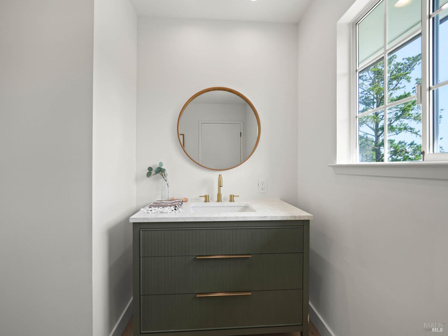 148 Dominican Drive San Rafael, CA 94901 - Photo 23 of 60 a bathroom with a sink and a mirror
