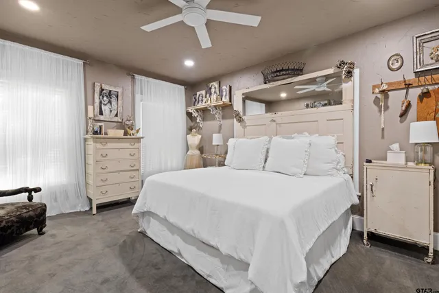 a bedroom with a bed and cabinets