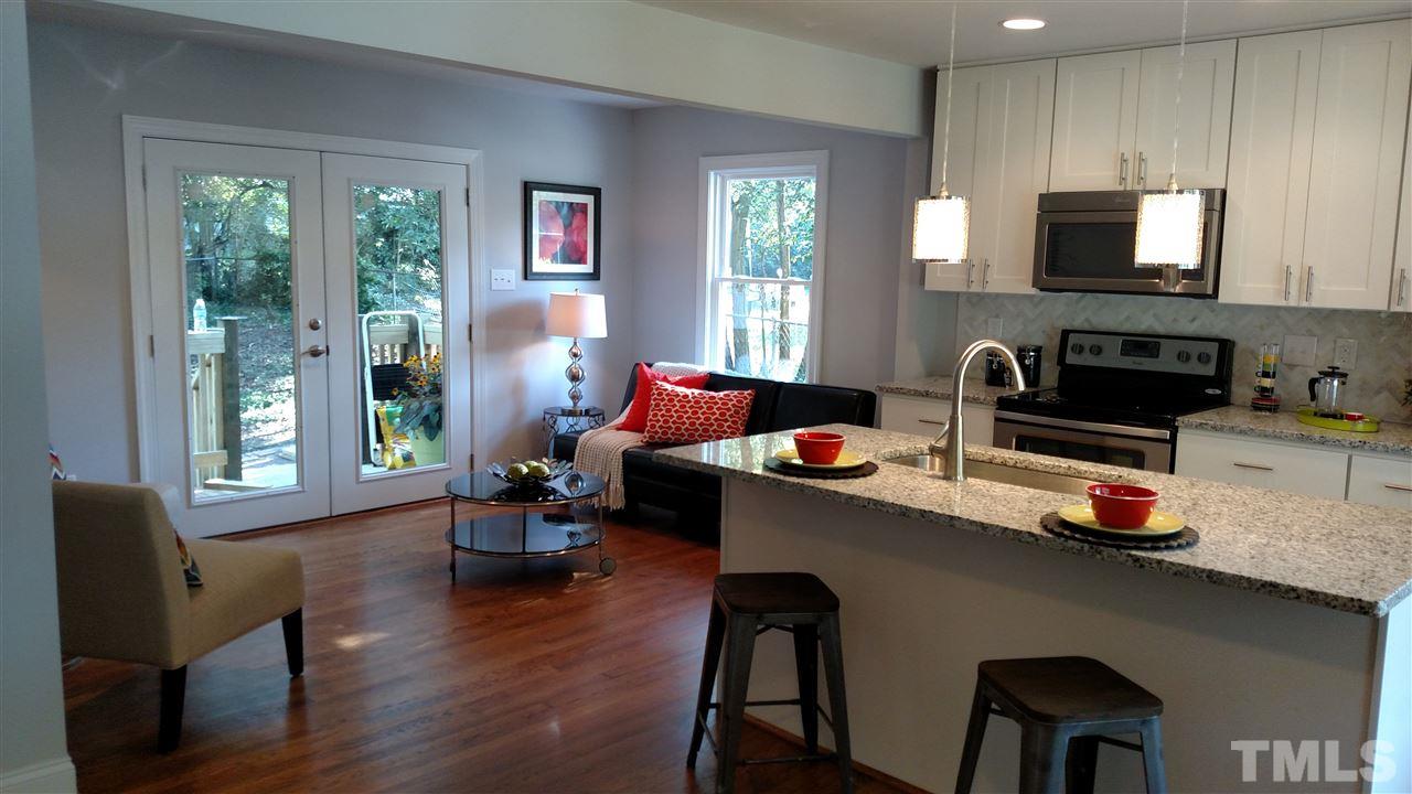 2318 Kennington Road Raleigh, NC 27610 - Photo 1 of 20 a dining room with furniture and wooden floor