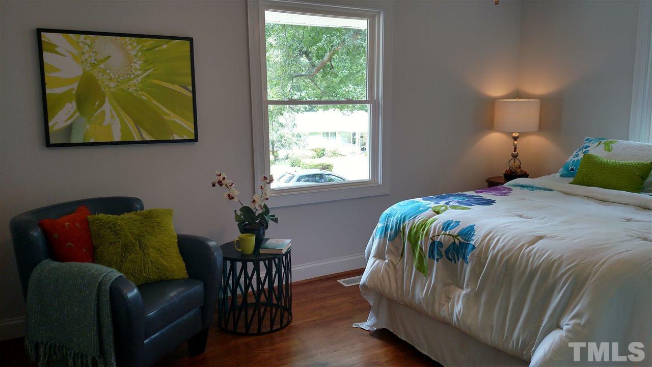 2318 Kennington Road Raleigh, NC 27610 - Photo 9 of 20 a bedroom with a bed and window