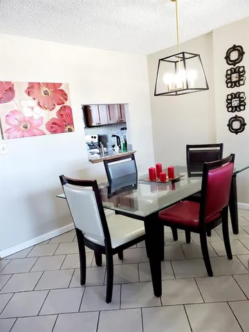 a view of a workspace with furniture