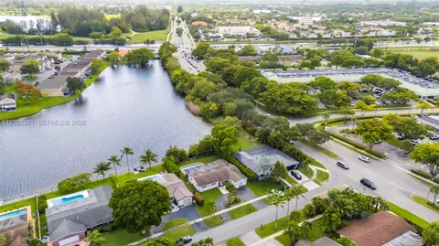 an aerial view of residential houses with outdoor space