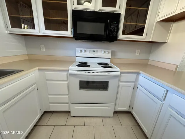 a kitchen with a stove and a microwave