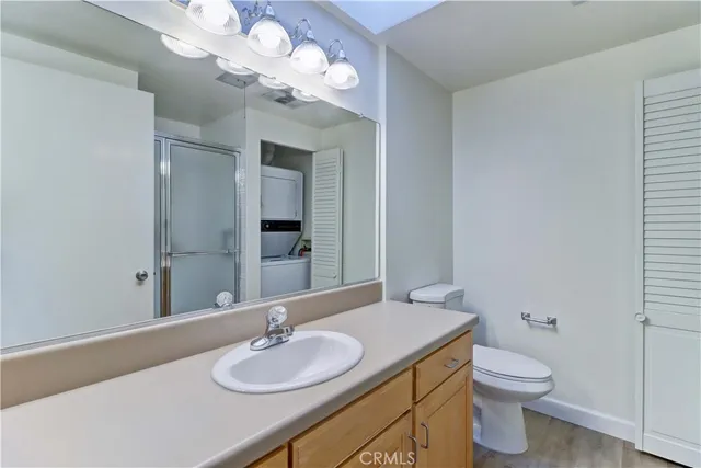 a bathroom with a sink vanity and a mirror