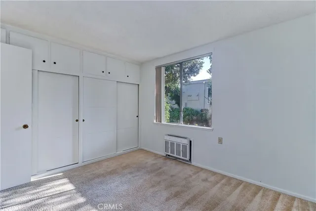 a view of room with kitchen