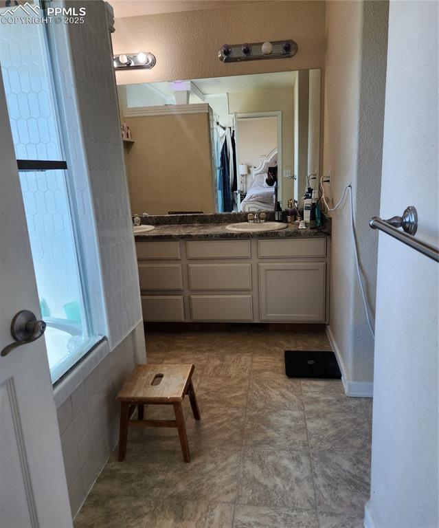 4530 Sierra Rica Road Colorado Springs, CO 80911 - Photo 29 of 44 a room with mirror and window