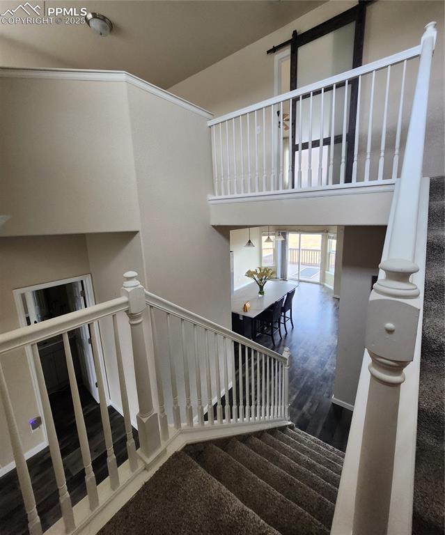 4530 Sierra Rica Road Colorado Springs, CO 80911 - Photo 43 of 44 Stairs with wood finished floors