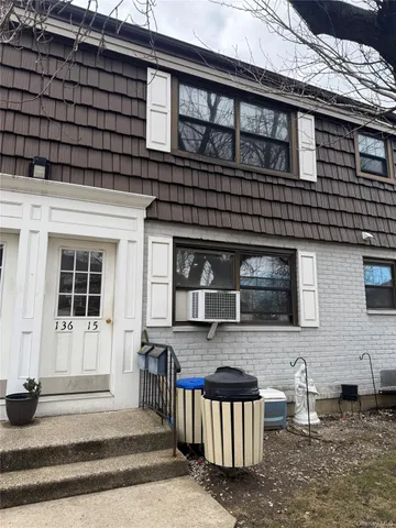 a bedroom with a bed and a mirror