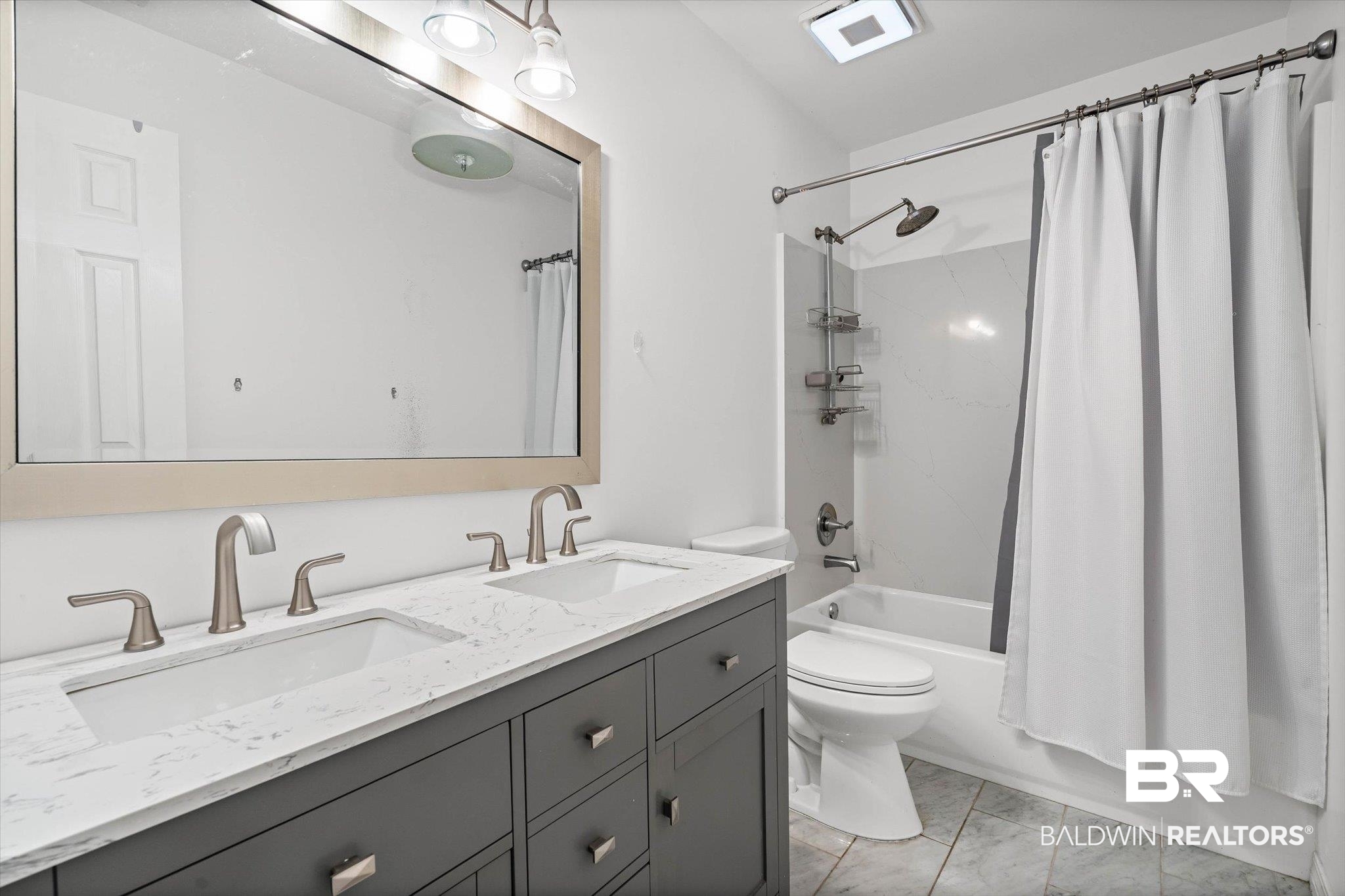 11 York Place Mobile, AL 36608 - Photo 13 of 24 Bathroom featuring double vanity and shower / bath combo with shower curtain