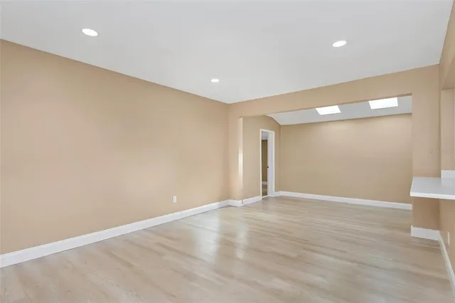 a view of room with wooden floor