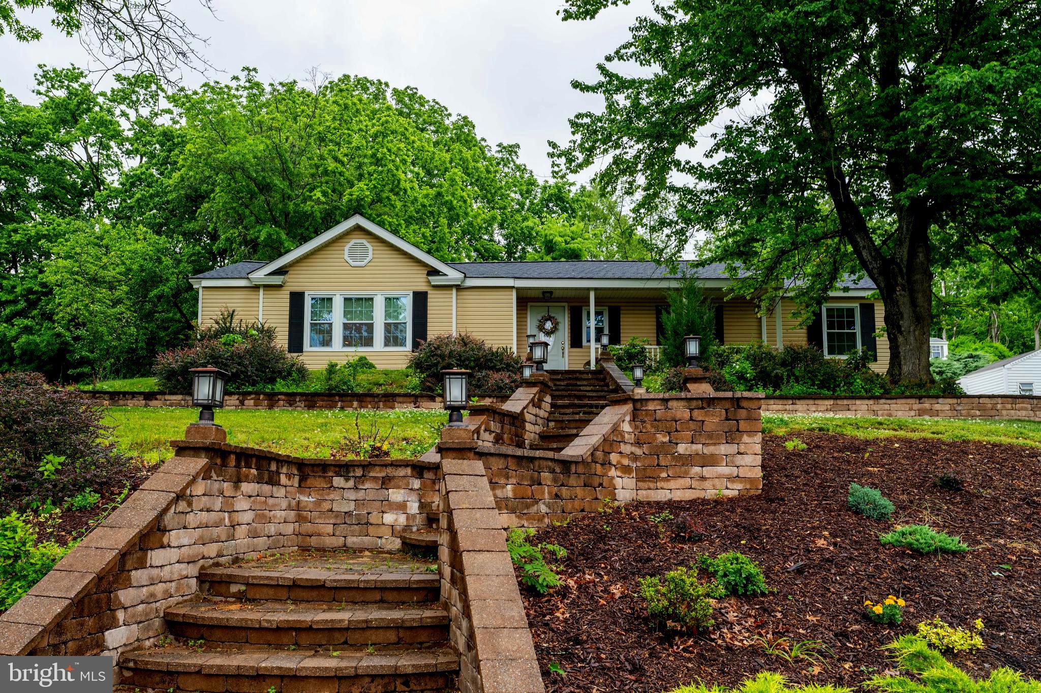 2941 Pheasant Run Road Norristown, PA 19403 - Photo 2 of 23 a front view of a house with garden
