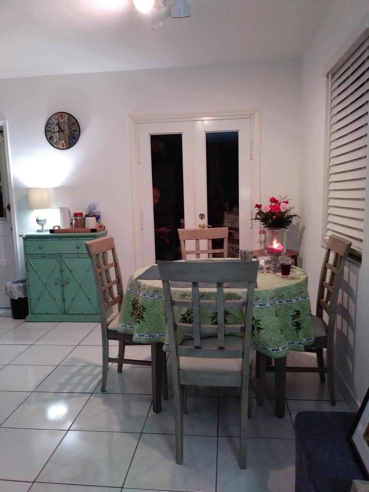 1612 Laird Street Key West, FL 33040 - Photo 14 of 18 a workspace with furniture and a potted plant