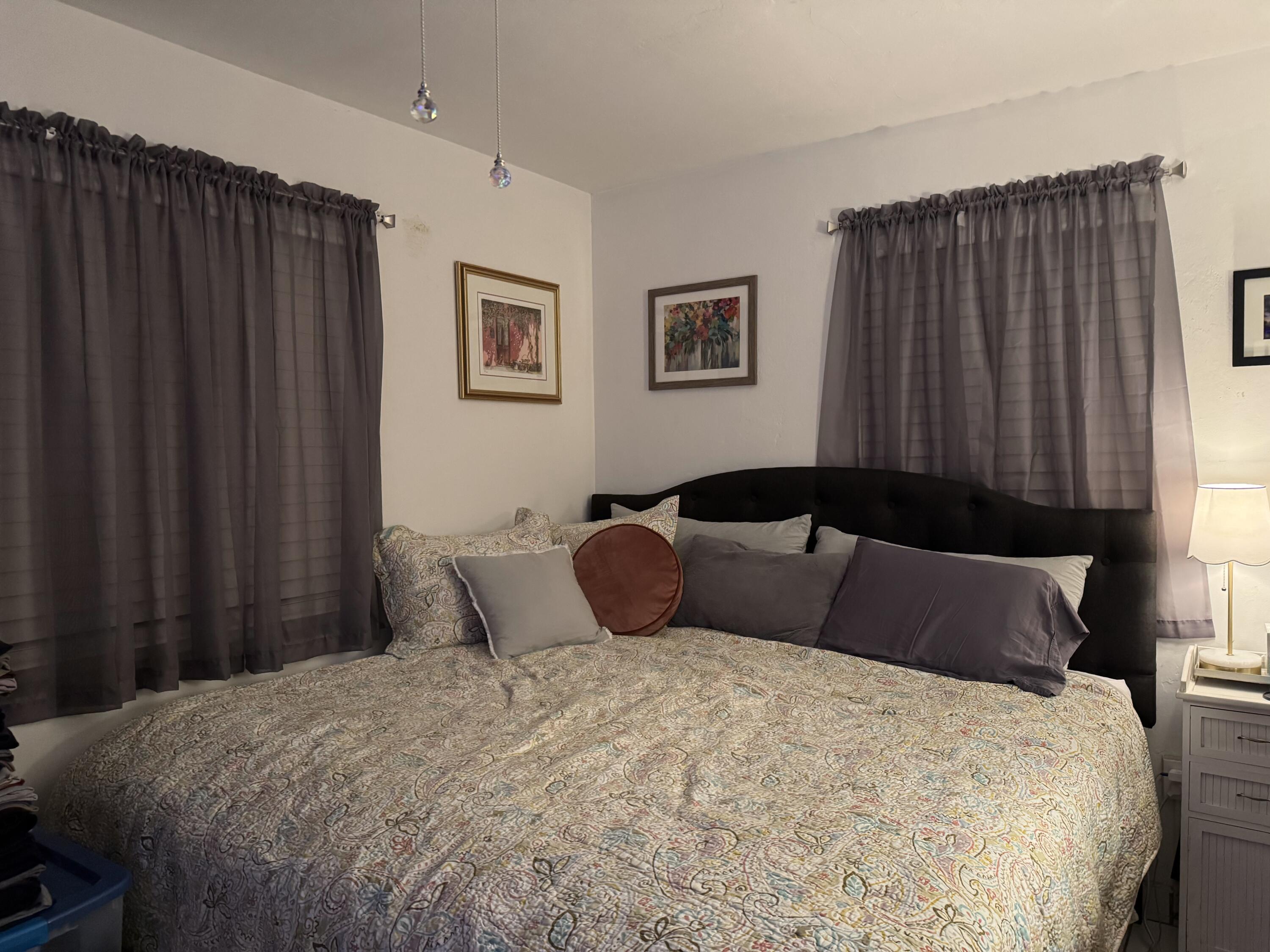 1612 Laird Street Key West, FL 33040 - Photo 18 of 18 a bedroom with a large bed and a chair