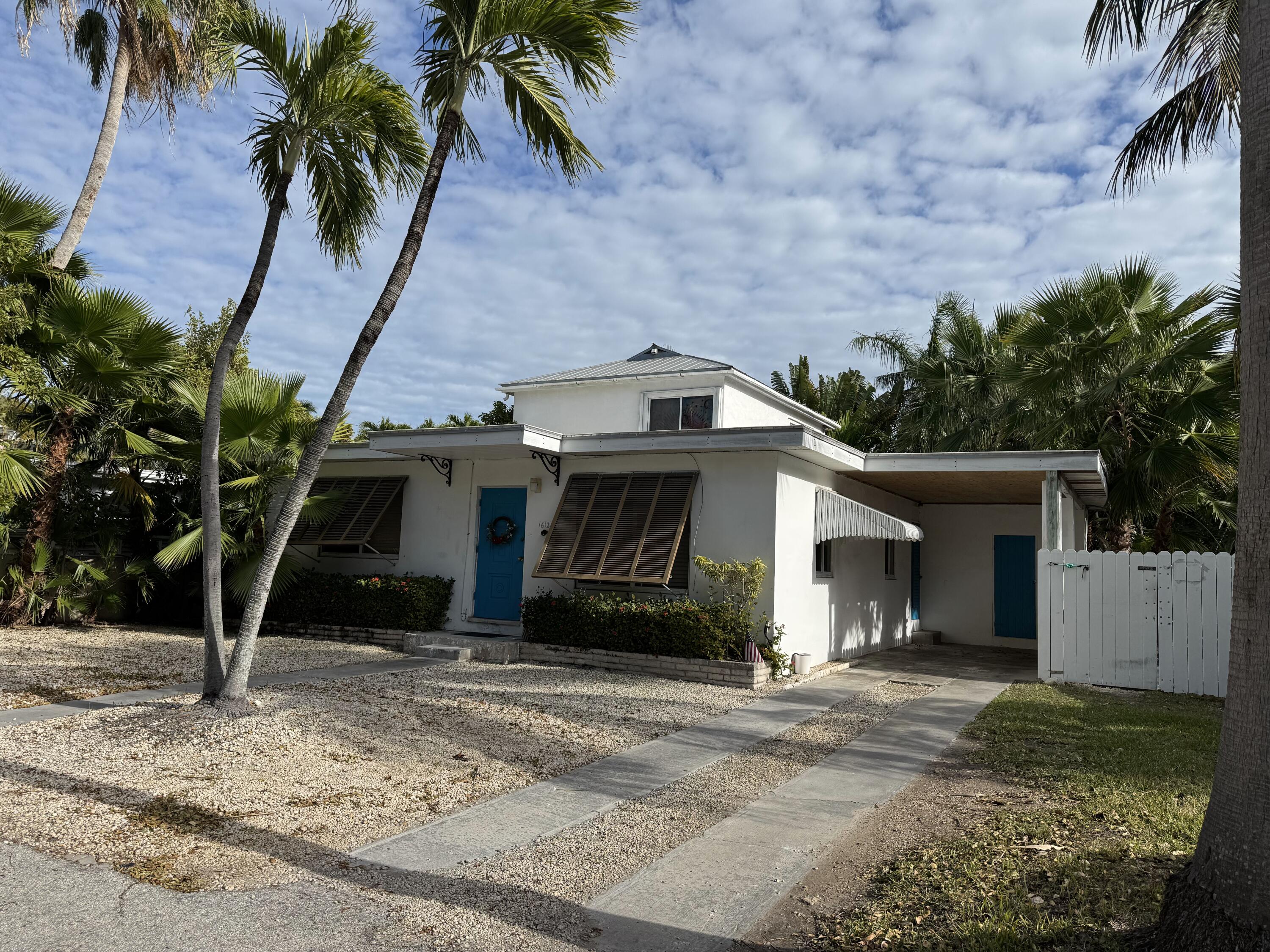 1612 Laird Street Key West, FL 33040 - Photo 2 of 18 a view of a house with a yard