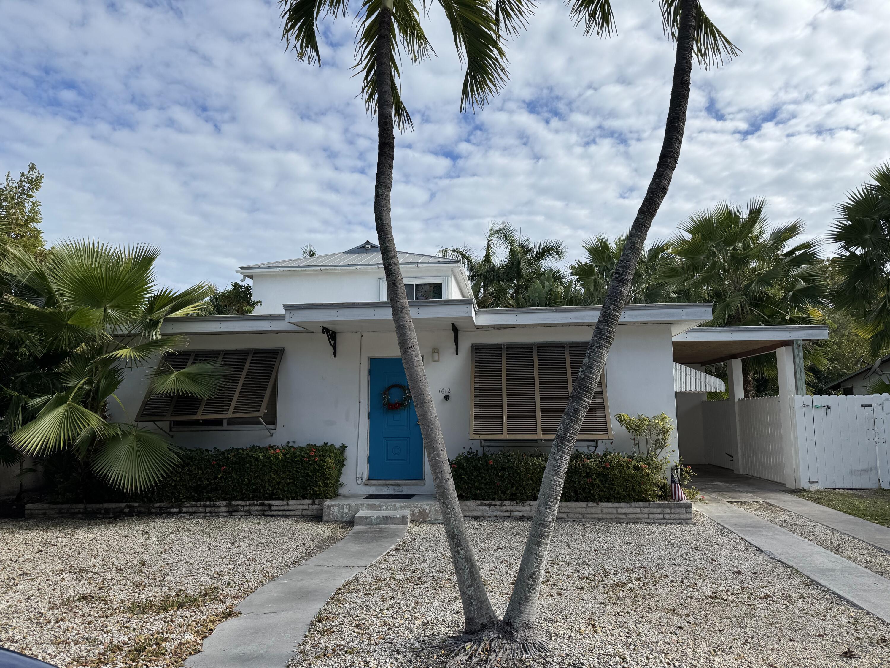 1612 Laird Street Key West, FL 33040 - Photo 3 of 18 a front view of a house with garden