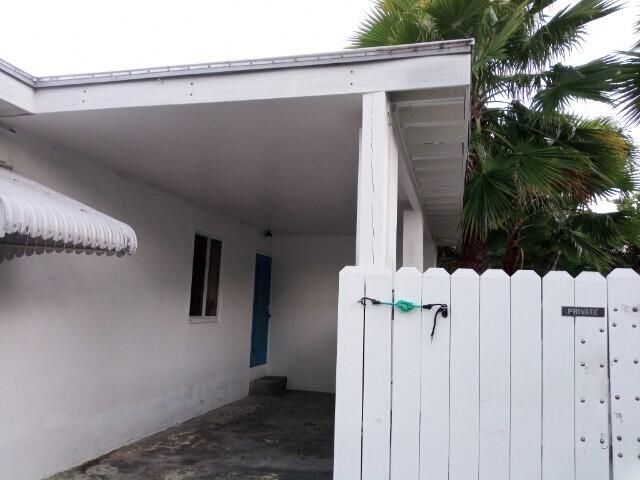 1612 Laird Street Key West, FL 33040 - Photo 5 of 18 a view of a house with a wooden fence