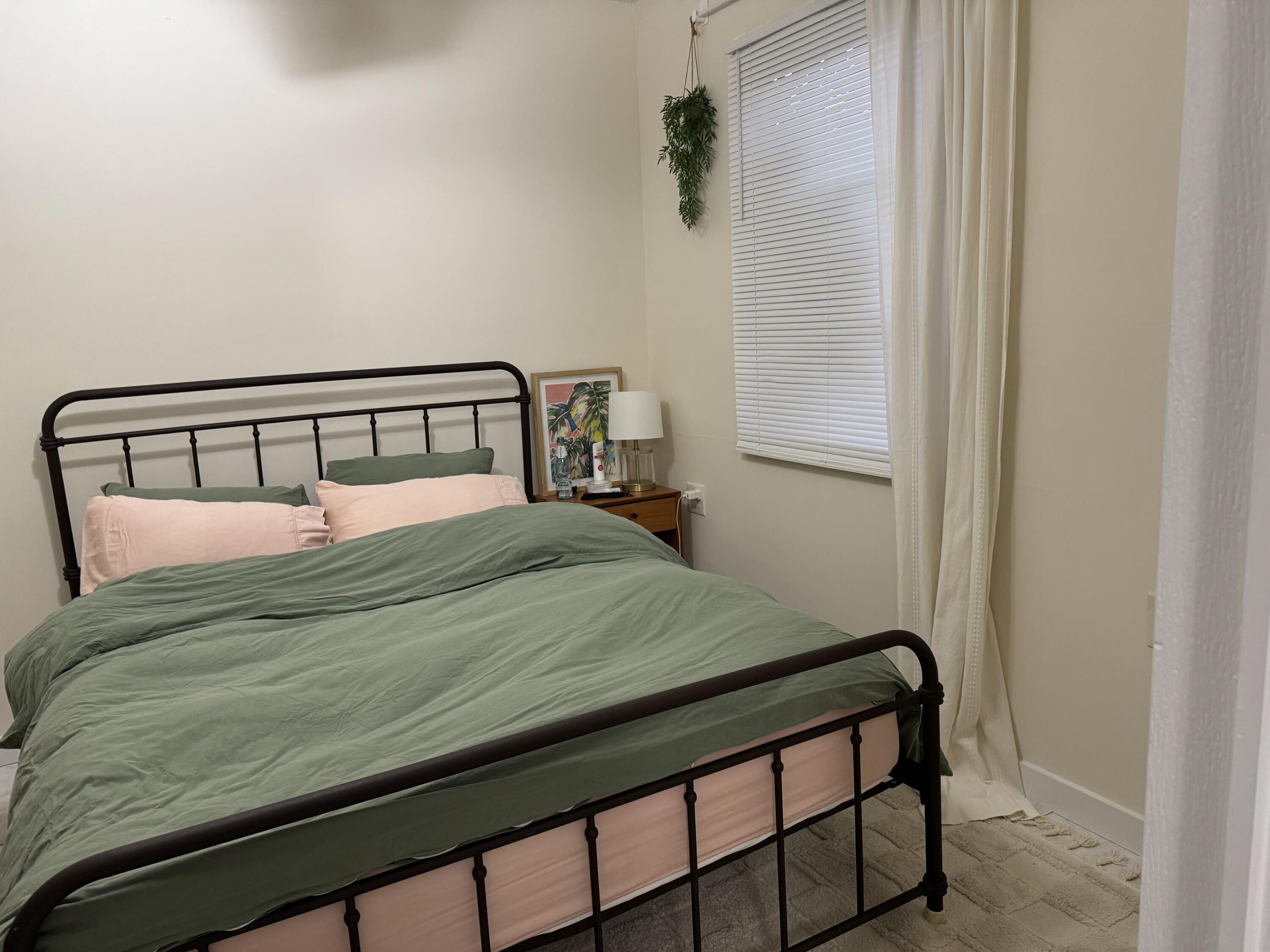 1612 Laird Street Key West, FL 33040 - Photo 9 of 18 a bedroom with a bed and a window