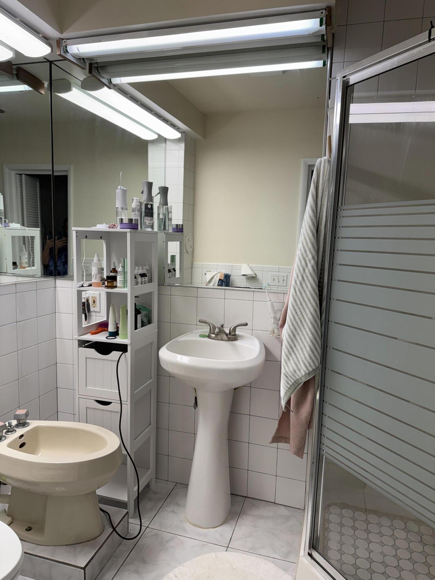 1612 Laird Street Key West, FL 33040 - Photo 10 of 18 a bathroom with a sink toilet and shower