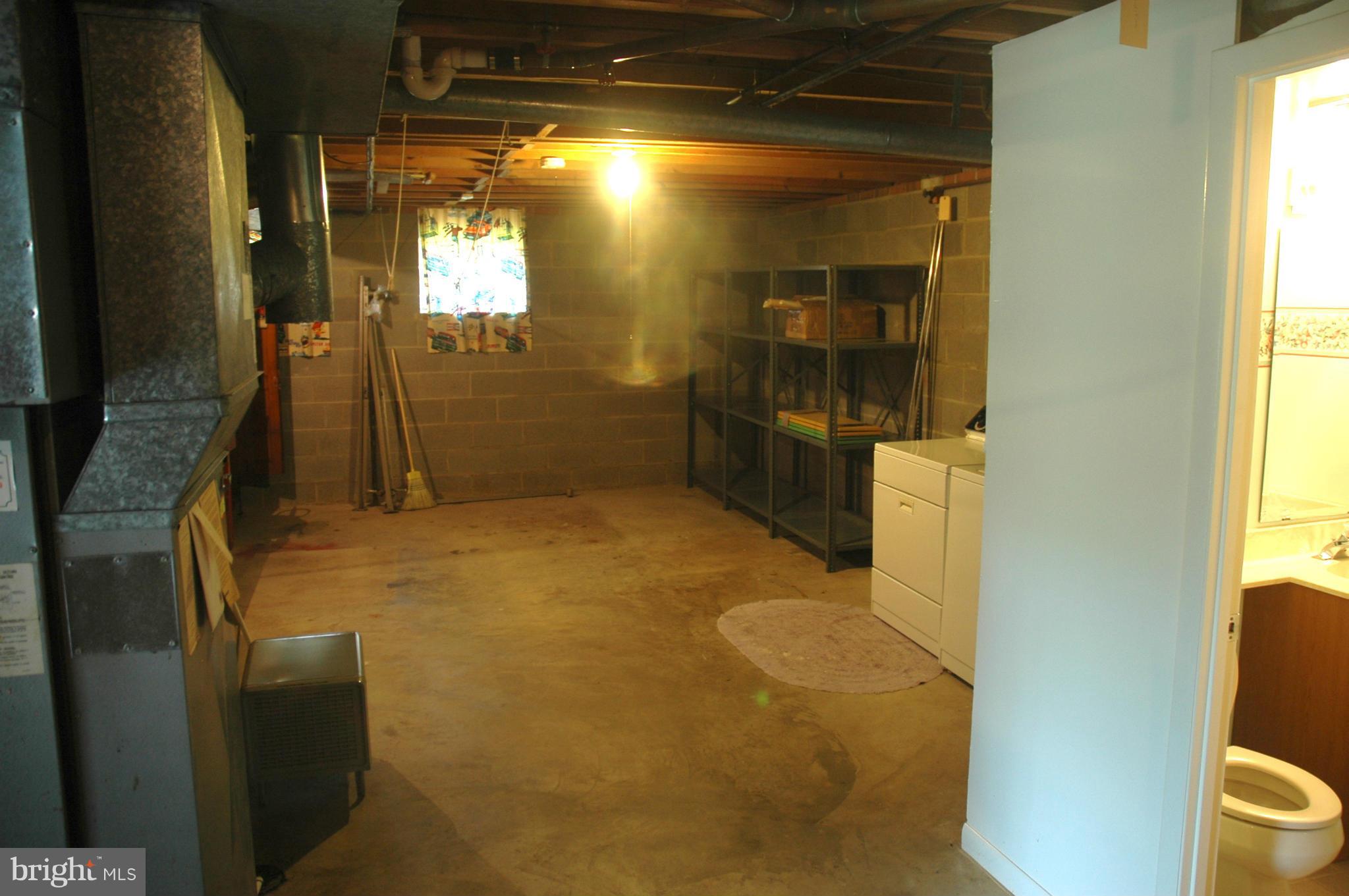 14717 Flintstone Lane Silver Spring, MD 20905 - Photo 22 of 26 a bathroom with a sink toilet and shower