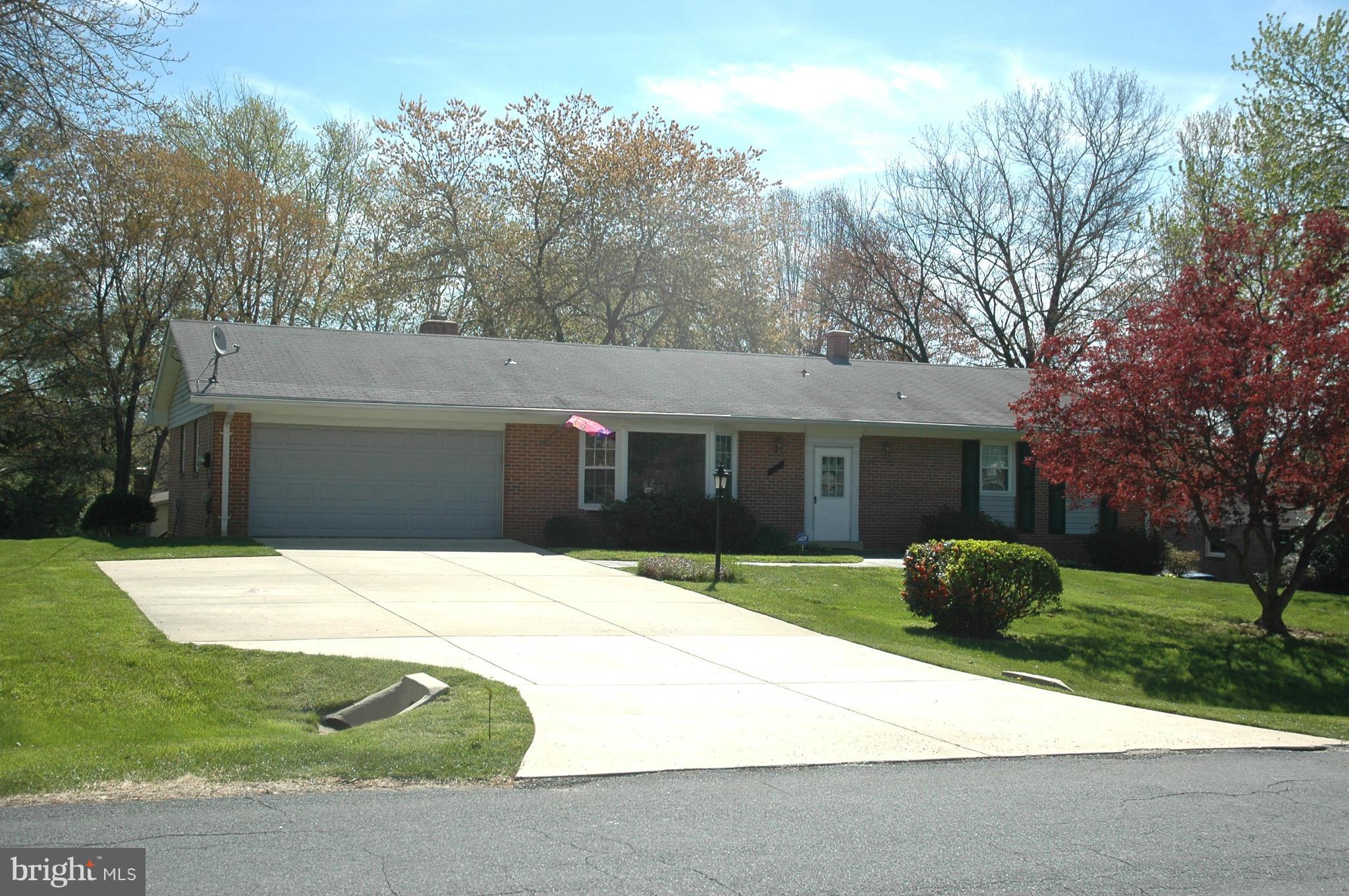 14717 Flintstone Lane Silver Spring, MD 20905 - Photo 26 of 26 a house that has a tree in front of it
