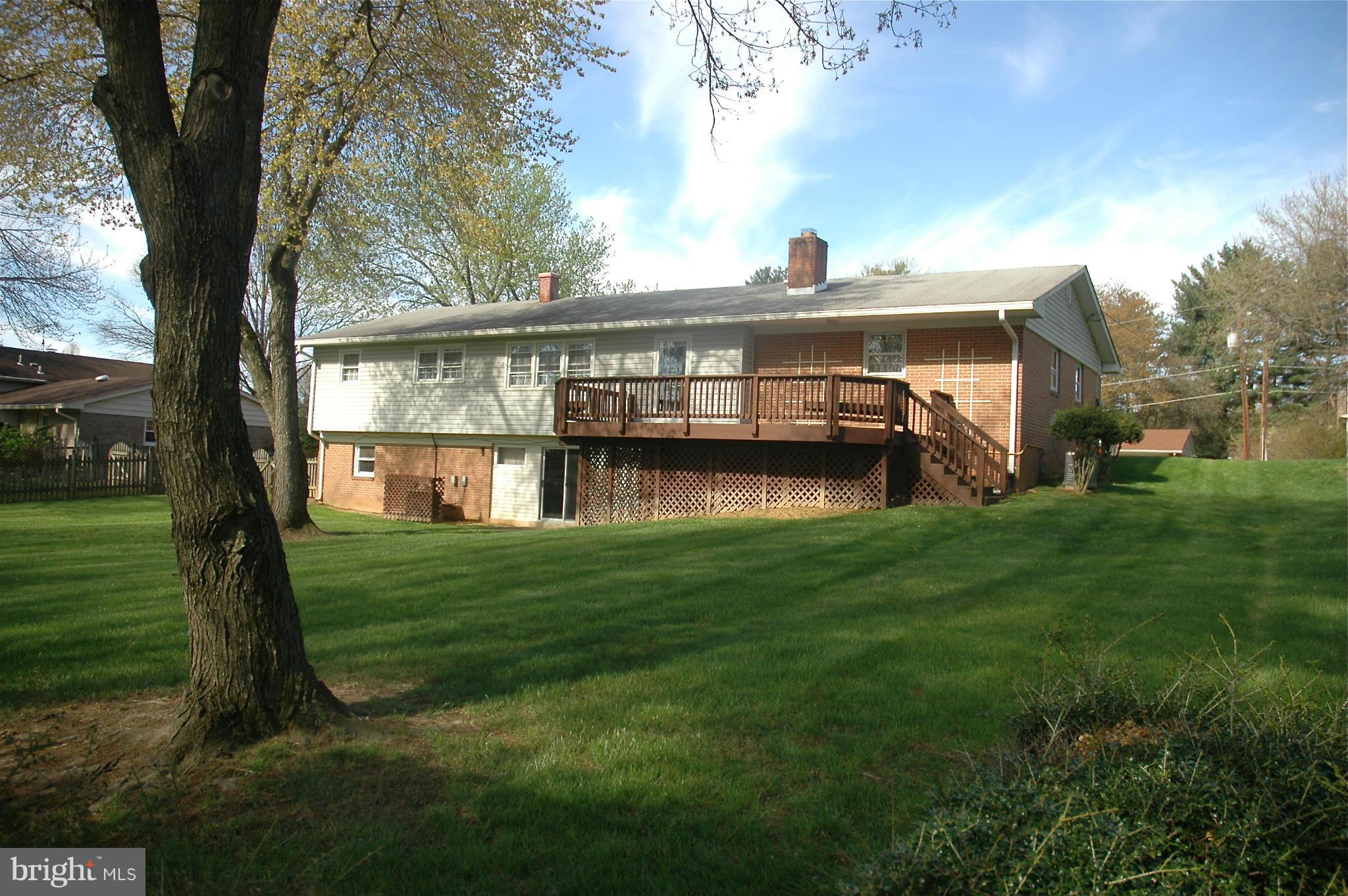 14717 Flintstone Lane Silver Spring, MD 20905 - Photo 4 of 26 a view of a house with a yard