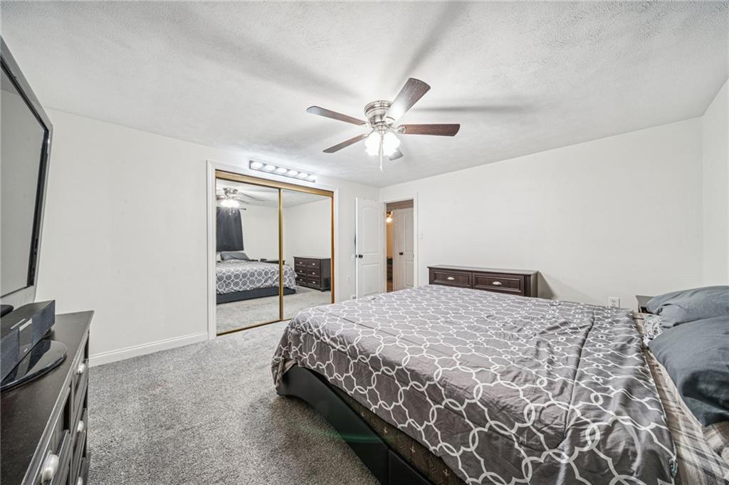 190 Urban Road Saltsburg, PA 15681 - Photo 14 of 44 a spacious bedroom with a bed and a chandelier